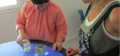 Acquisition of Joint Attention and Social Abilities through music Tangible User Interface: children with Autism Spectrum Condition and the Reactable experience